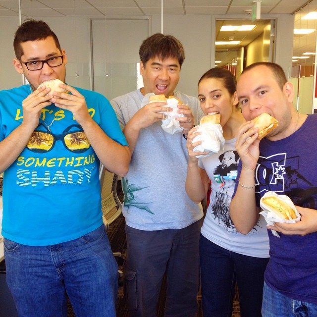 Office team eating Breakfast Basile sandwiches