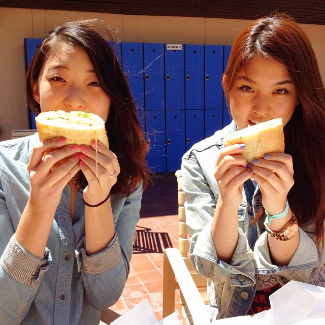 Two friends with Breakfast Basile sandwiches